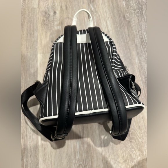 disney the nightmare before christmas headless jack skellington mini backpack Loungefly POP House Backpack: Clothing, Shoes & Jewelry It is made of faux leather and features a top zipper closure and front zippered pocket The Nightmare Before Christmas Smiling